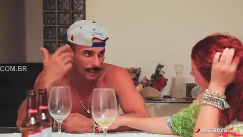 Blowing his buddy under the table in front of the family